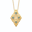 Collier losange à écailles et cabochons bleus en acier doré