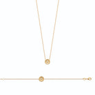 Collier médaille perlée à fleurette zircon en plaqué or