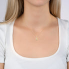 Collier médaillon navette ajouré et zircon ovale en plaqué or