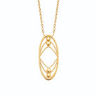 Collier médaillon ovale ajouré à chaînettes perlées en acier doré