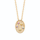 Collier médaillon ovale en résille tressée et pierres de couleur en plaqué or