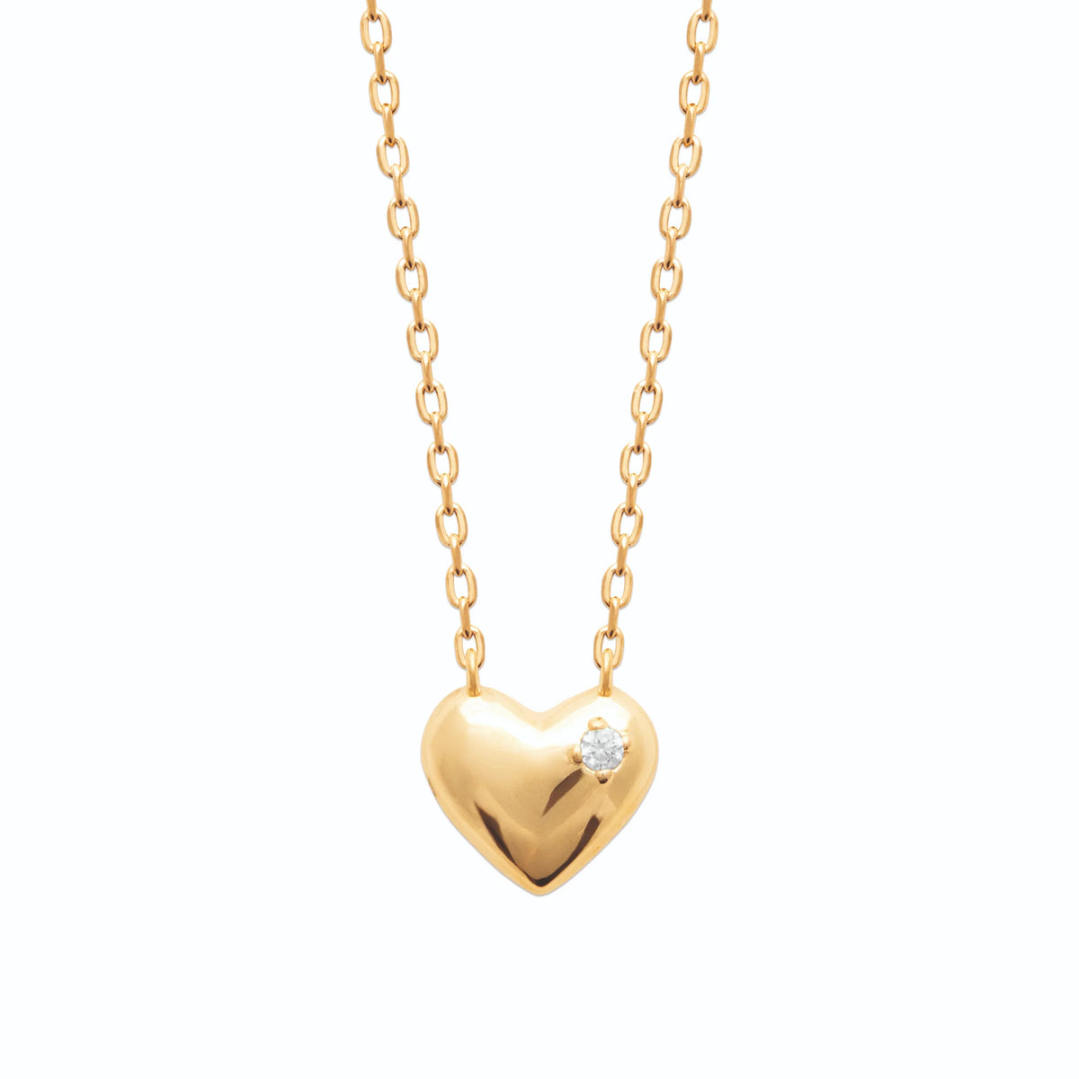 Collier petit cœur bombé poli piqué d’un zircon en plaqué or