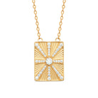Collier plaque rayonnante et croix de zircons en plaqué or