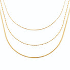 Collier triple rang chaîne serpent et grain de riz en acier doré