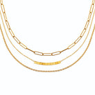 Collier trois rangs trombone et barrette de cubes en acier doré