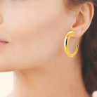 Boucles d’oreilles créoles effilées en acier PVD doré