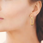 Boucles d’oreilles pendantes cercle et ovale en acier PVD doré