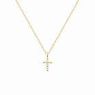 Pendentif croix à boules serties de zircons en plaqué or vu de profil
