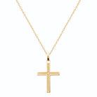 Pendentif croix bordée de cordelette en plaqué or vu de profil