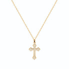 Pendentif croix fleurdelisée pavée de zircons en plaqué or vu de profil