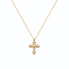 Pendentif croix perlée à boules en plaqué or vu de profil