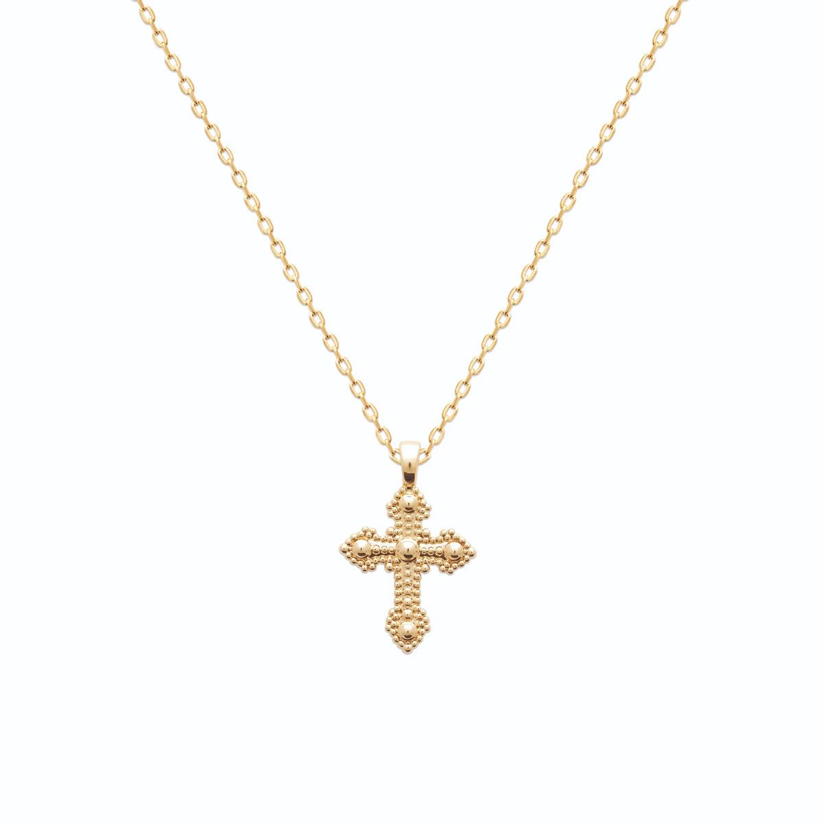 Pendentif croix perlée à boules en plaqué or vu de profil